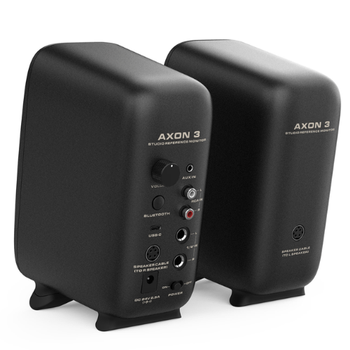 A pair of compact NUX Axon 3 active studio monitors displayed side by side. Each speaker features a black enclosure with a 3-inch woofer and a ¾-inch silk dome tweeter on the front, finished with a clean, minimalist design and NUX branding. The speakers are intended for nearfield studio monitoring and include modern connectivity such as USB DAC, Bluetooth, RCA, AUX, and ¼-inch inputs. They are designed for home studios, content creators, and portable professional audio setups