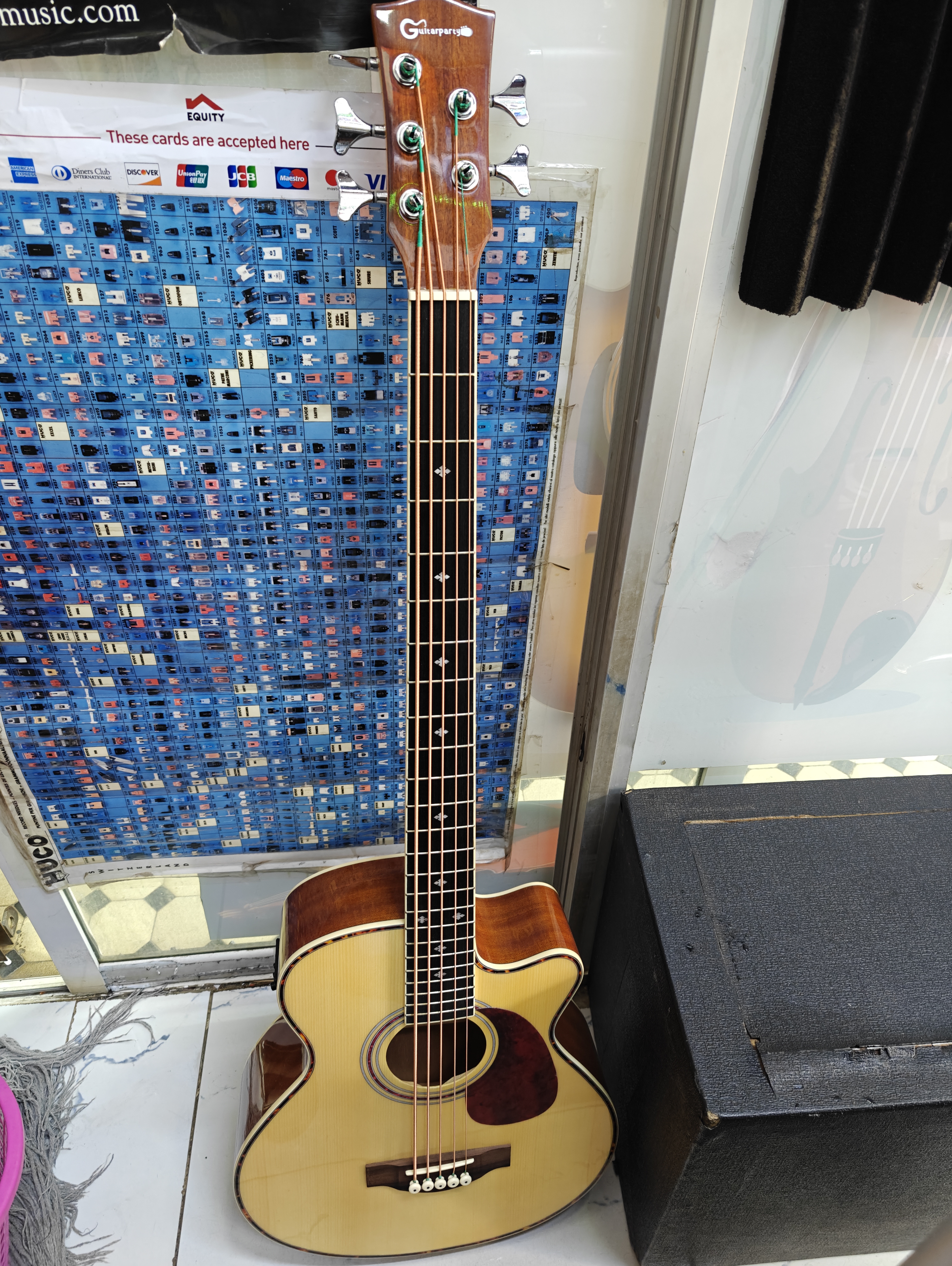 Full-size 5-string acoustic bass guitar with cutaway body, built-in EQ preamp, natural wood finish, and extended low B string for live performance and recording. Full-size 5-string acoustic bass guitar with cutaway body, built-in EQ preamp, natural wood finish, and extended low B string for live performance and recording.