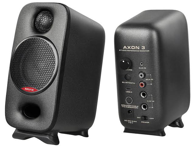NUX Axon 3 Studio Reference Monitors—a pair of compact black powered studio monitor speakers with front-facing drivers and the NUX logo, designed for desktop music production, mixing, recording, and multimedia listening.