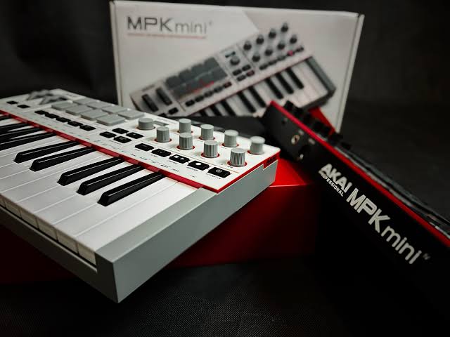 AKAI Professional MPK Mini MK4 25-Key USB MIDI Keyboard Controller with RGB MPC Pads, OLED Display, USB-C Connectivity, and DAW Integration.